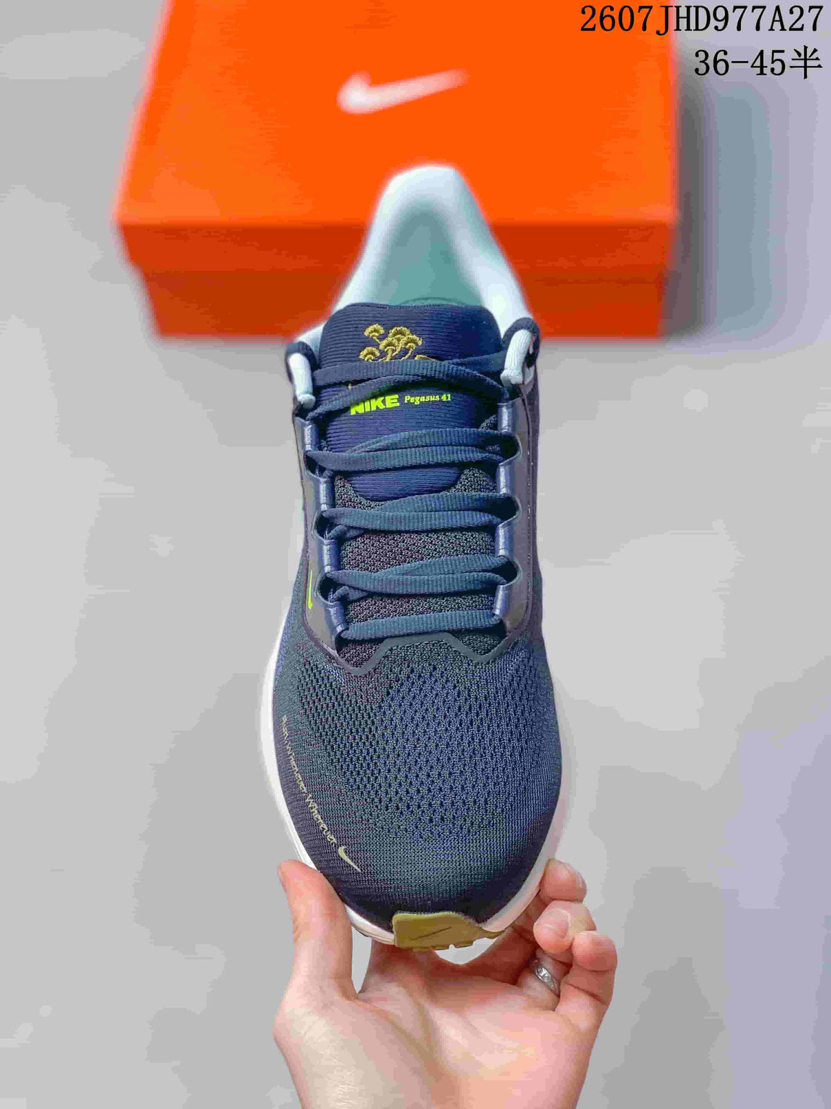 Top view of a navy lace-up running sneaker with lime branding accents and a rounded toe.