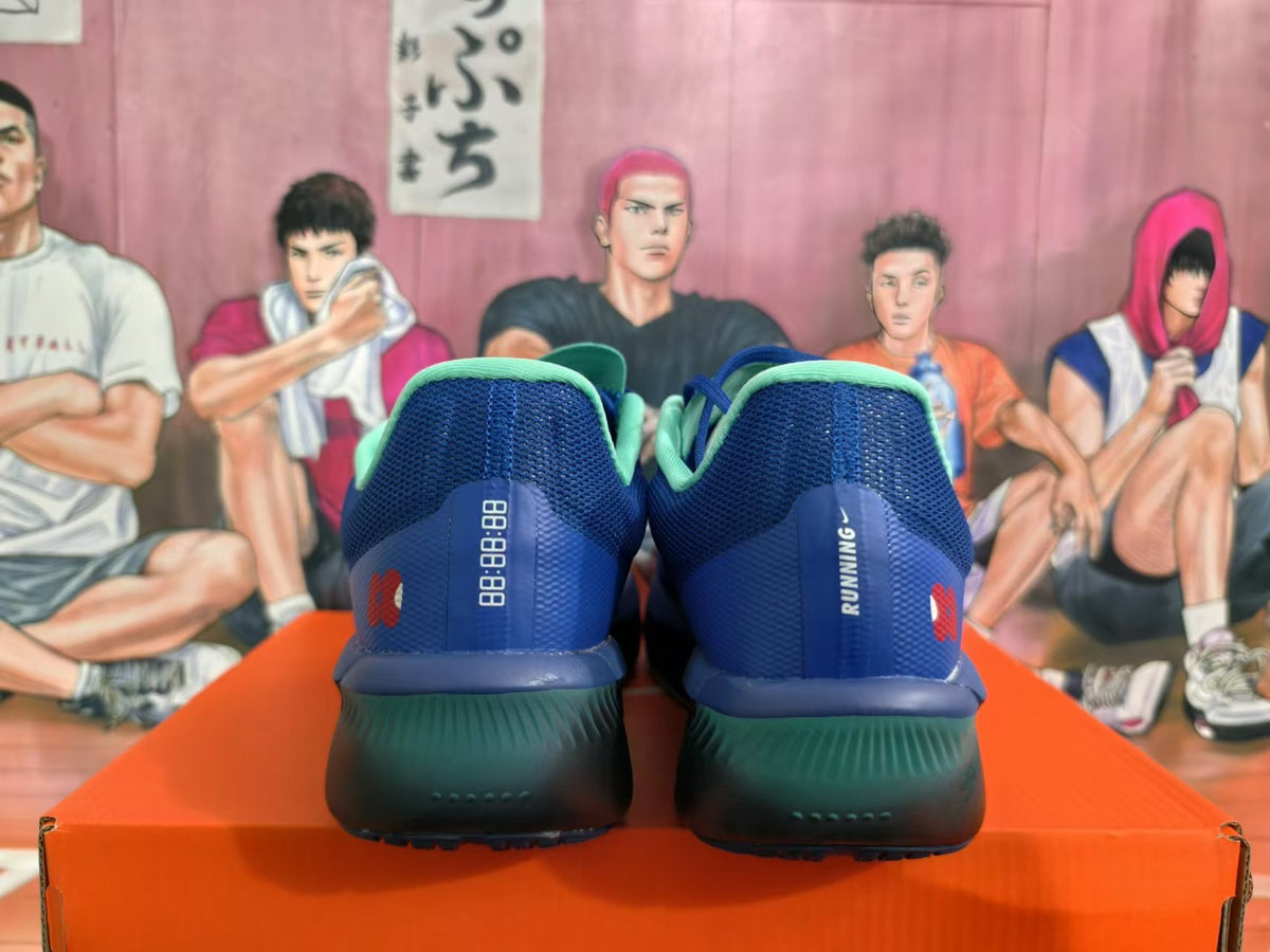 Rear view of blue Nike running shoes with mint collars and dark soles.