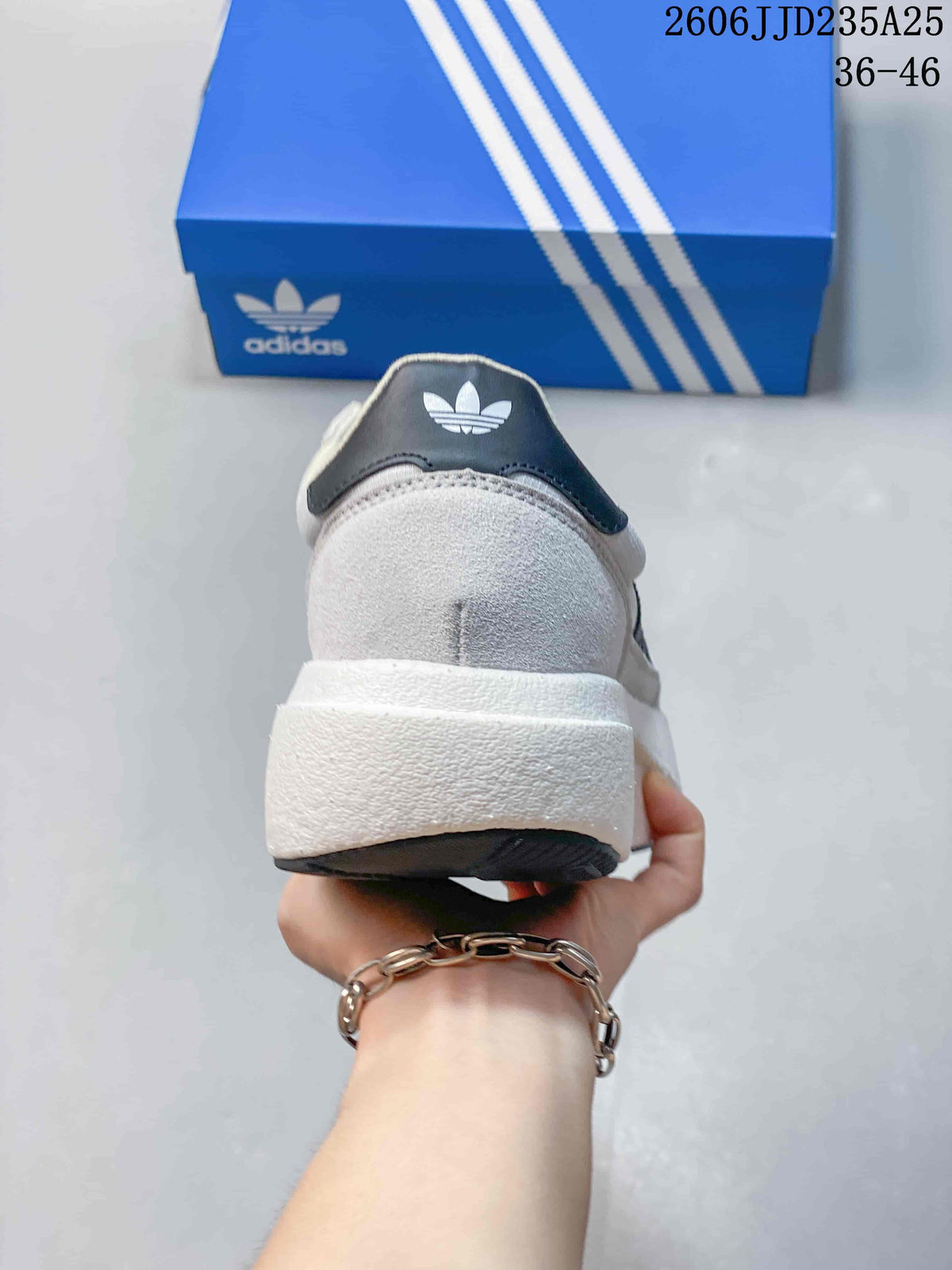 Rear view showing the padded heel collar, white midsole, and trefoil branding.