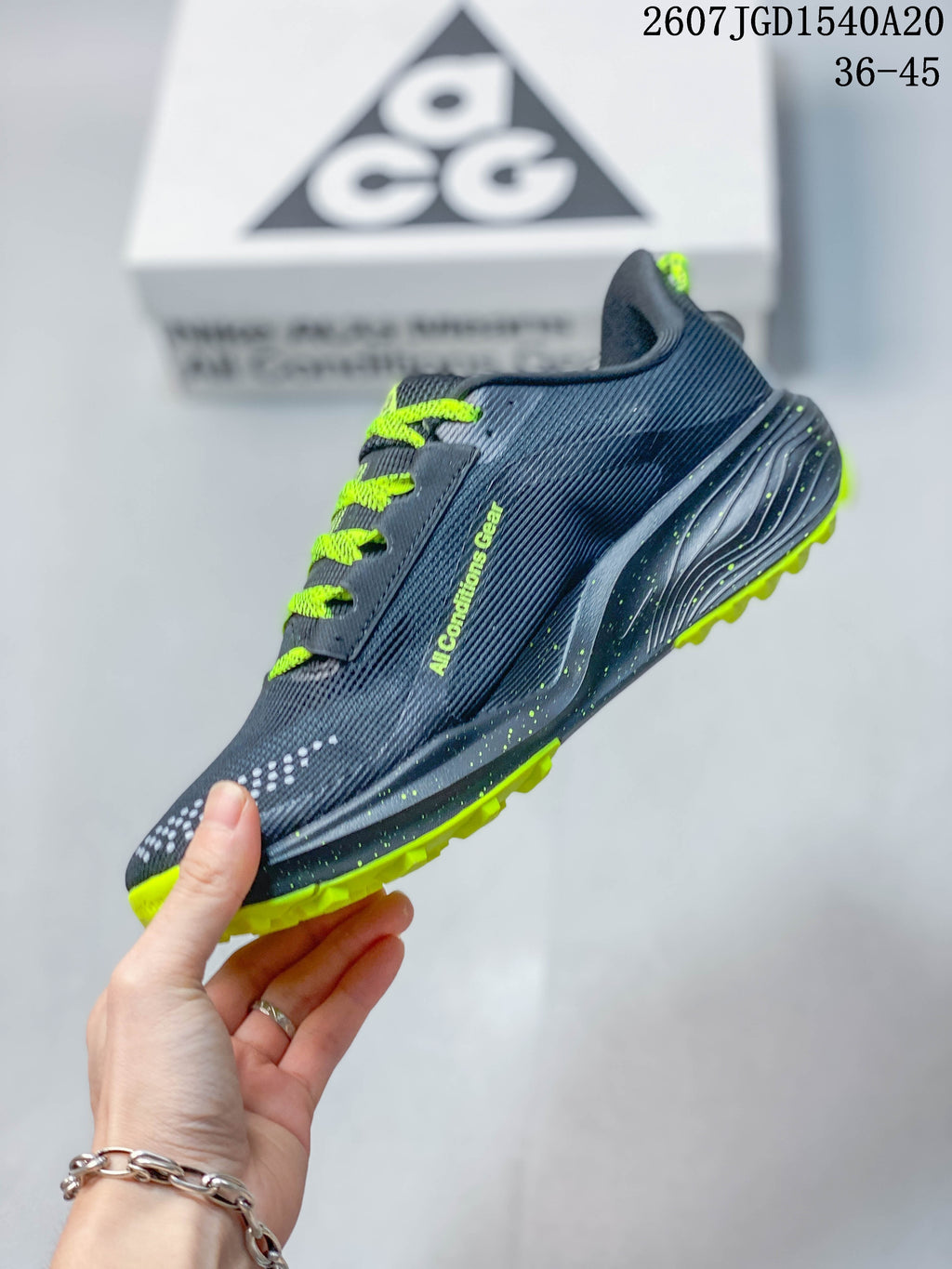 Side view showing the textile-look upper, swoosh, neon green laces, and layered midsole.