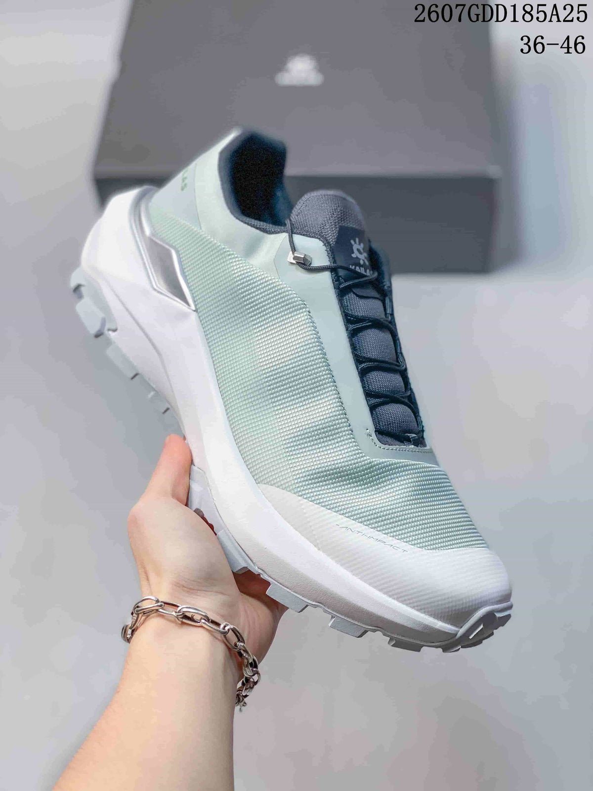 Side view of a pale mint and white KAILAS VENTO sneaker showing the textured upper, lace system and lugged outsole.