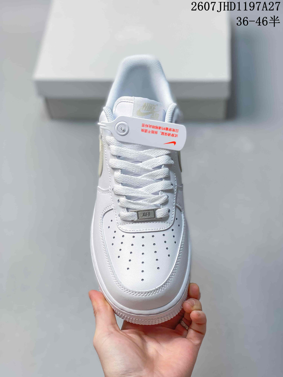 Top view showing the perforated toe box, white laces, padded tongue, and metallic lace detail.