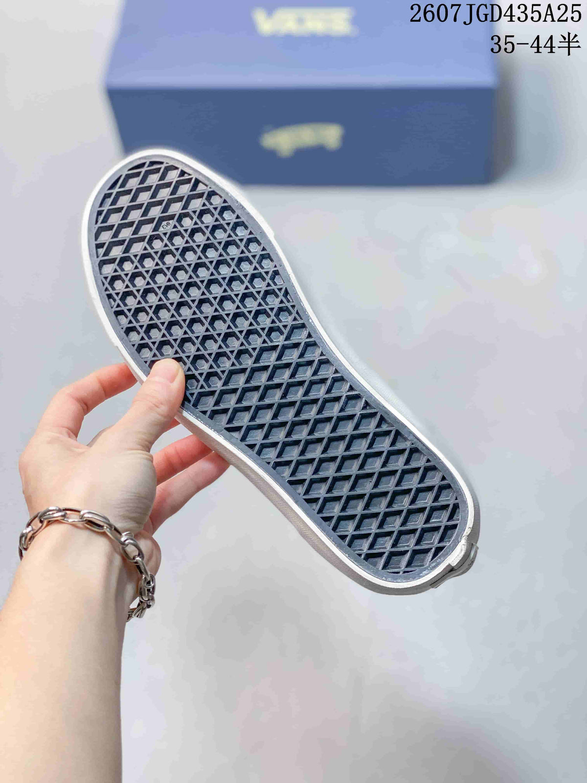 Close view of the patterned outsole with a white sidewall