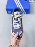 Top view showing the blue mesh toe box, cream laces, burgundy overlays and adidas tongue branding.