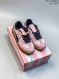 Pair of pink PUMA Palermo sneakers displayed on a pink PUMA shoebox.