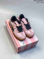 Pair of pink PUMA Palermo sneakers displayed on a pink PUMA shoebox.