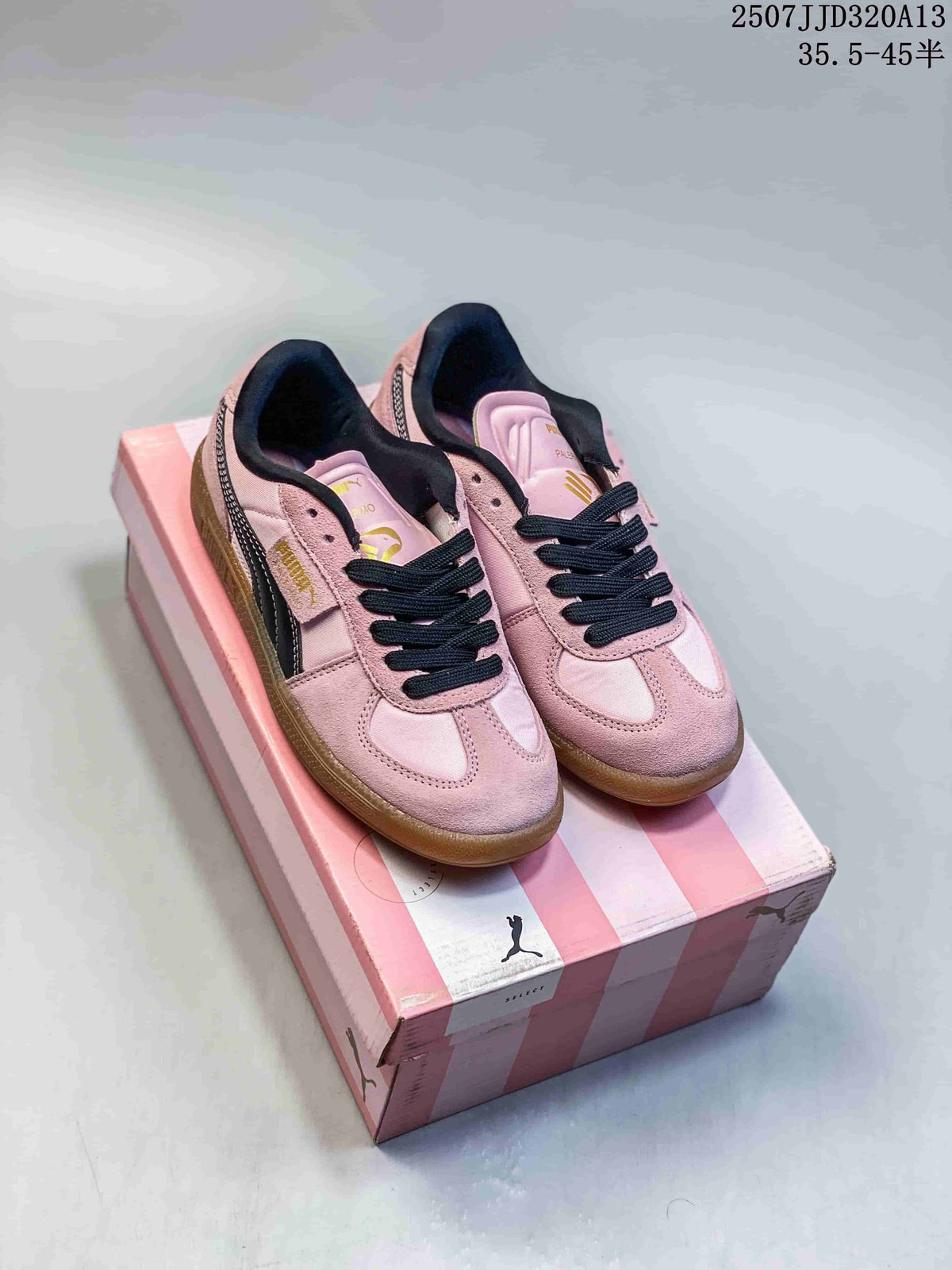 Pair of pink PUMA Palermo sneakers displayed on a pink PUMA shoebox.