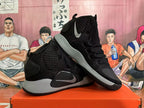 Pair of black Nike Hyperdunk basketball shoes shown at an angle