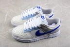 Angled view of the pair showing layered panels, blue side branding, and perforated toe boxes.