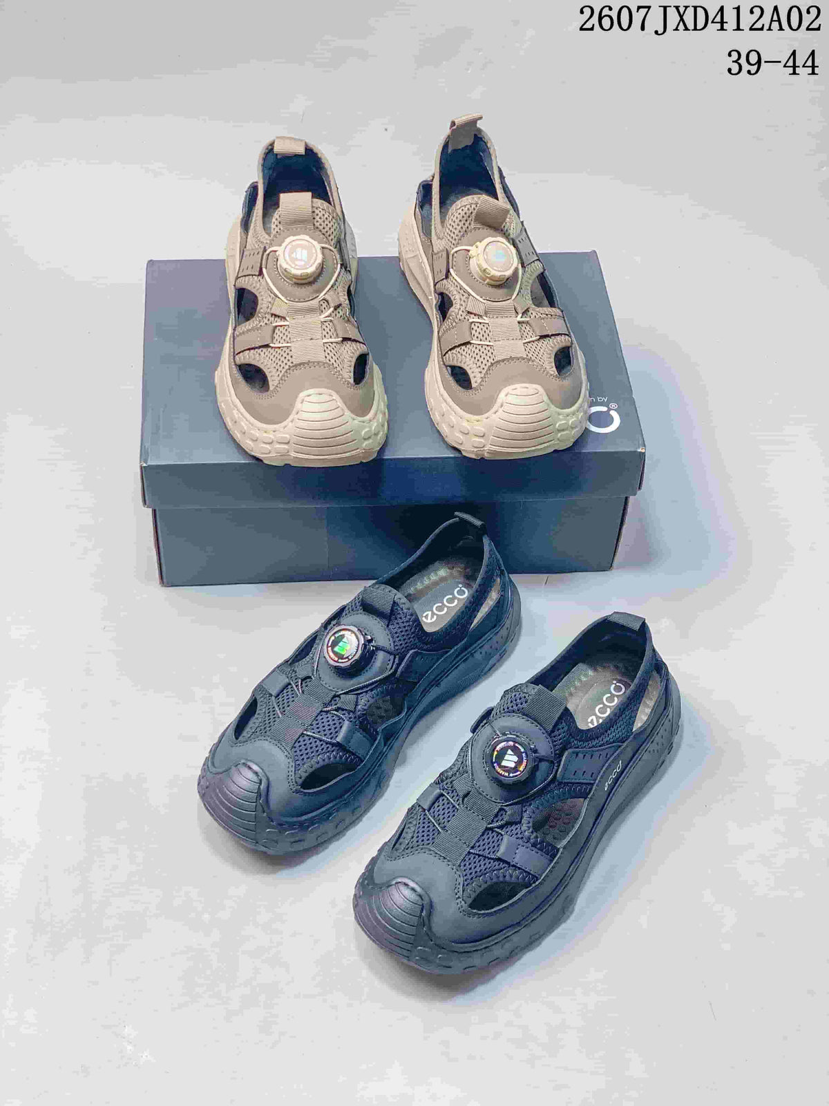 Taupe and dark gray colorways of ECCO closed-toe sandals with dial-style closures; image shows the range 39–44.