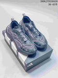 Pair of gray Adidas Holo Peak trail running shoes with patterned uppers and quick-lace closures
