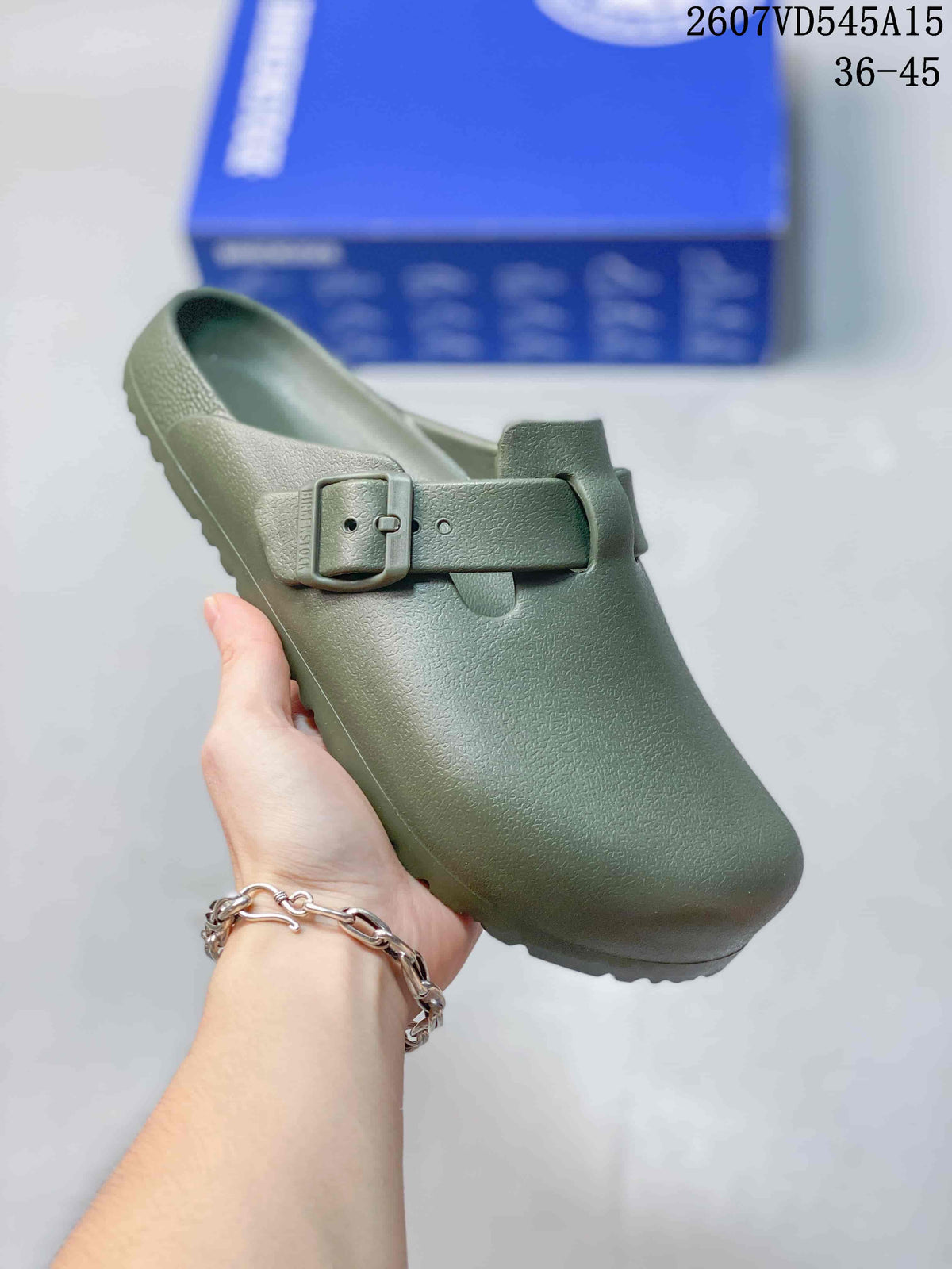 Olive green closed-toe buckle sandal shown from above with a blue box in the background.