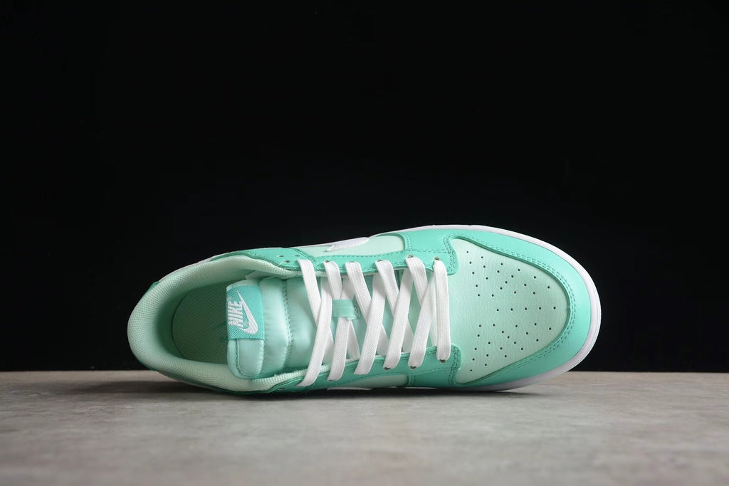 Top-down view of one sneaker showing the perforated toe box, white laces, tongue, and padded collar.