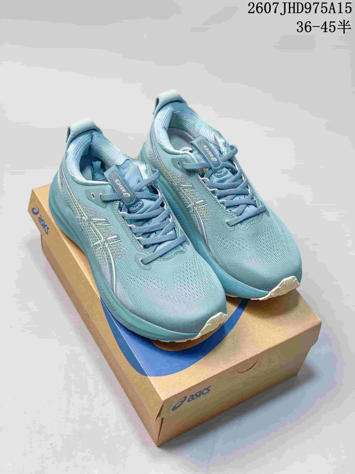 Pair of blue ASICS Gel-Kayano 33 sneakers displayed on an ASICS shoebox.