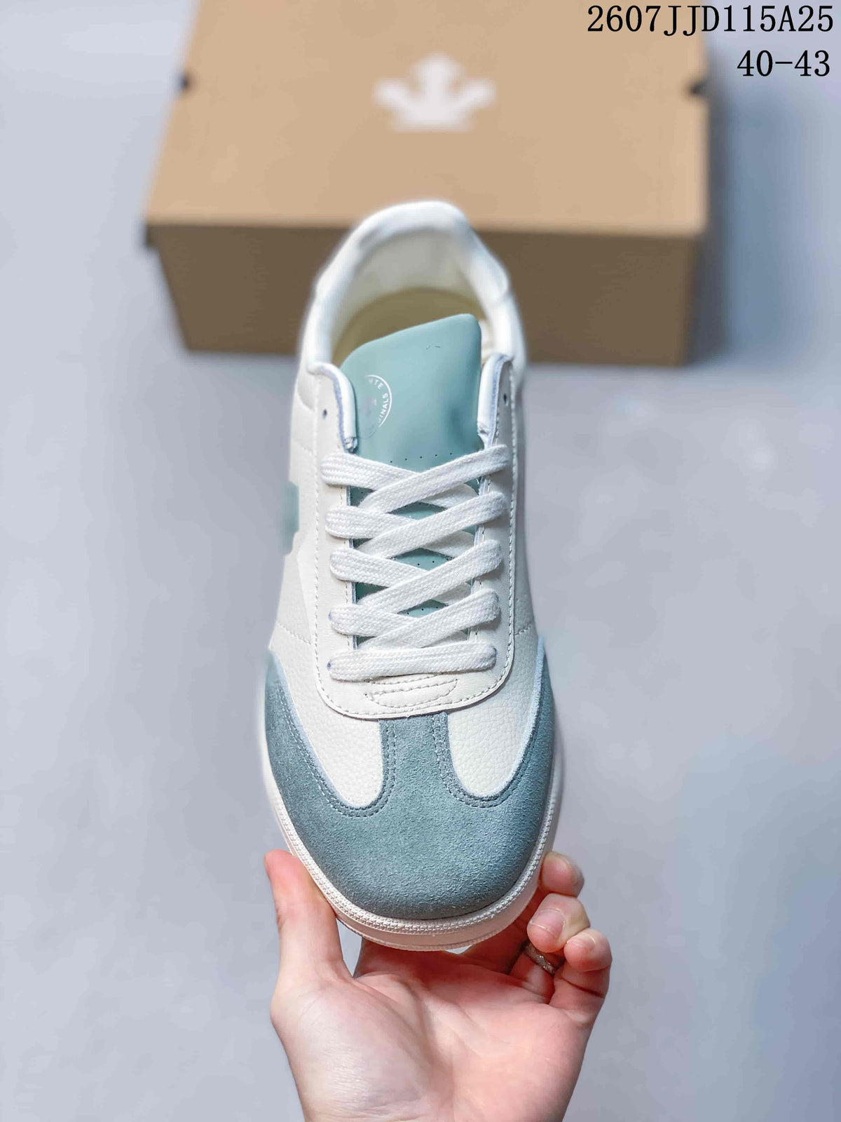 Top view showing the white laces, light blue tongue, white upper, and light blue toe panel.