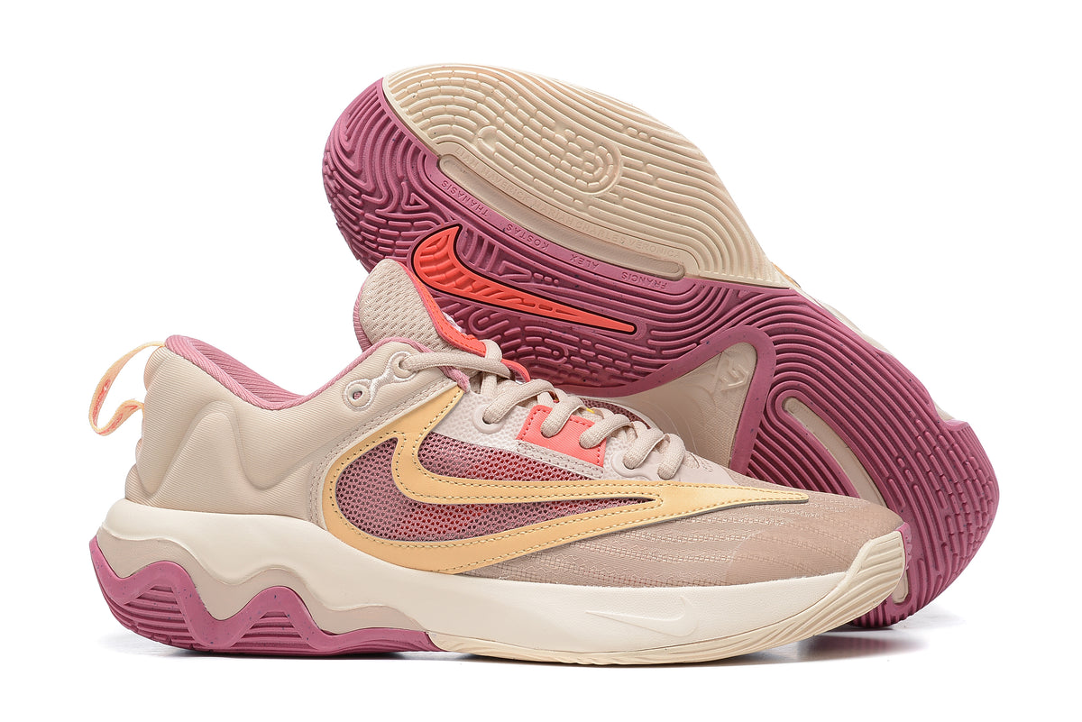 Pale pink and cream basketball shoe with rose-colored details