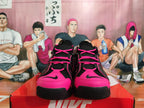 Front view of black and bright pink Nike sneakers with lace-up fastening