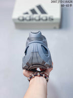 Rear view of the gray sneaker showing the padded heel collar, heel structure, and outsole tread.