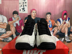 Front view of white and black Nike sneakers with black laces