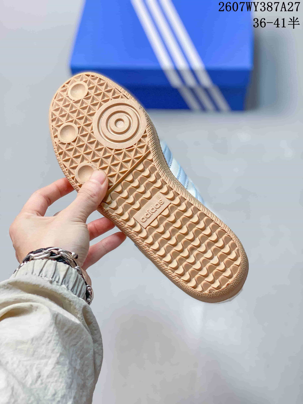 Close view of the gum-colored outsole with textured geometric tread and adidas branding.
