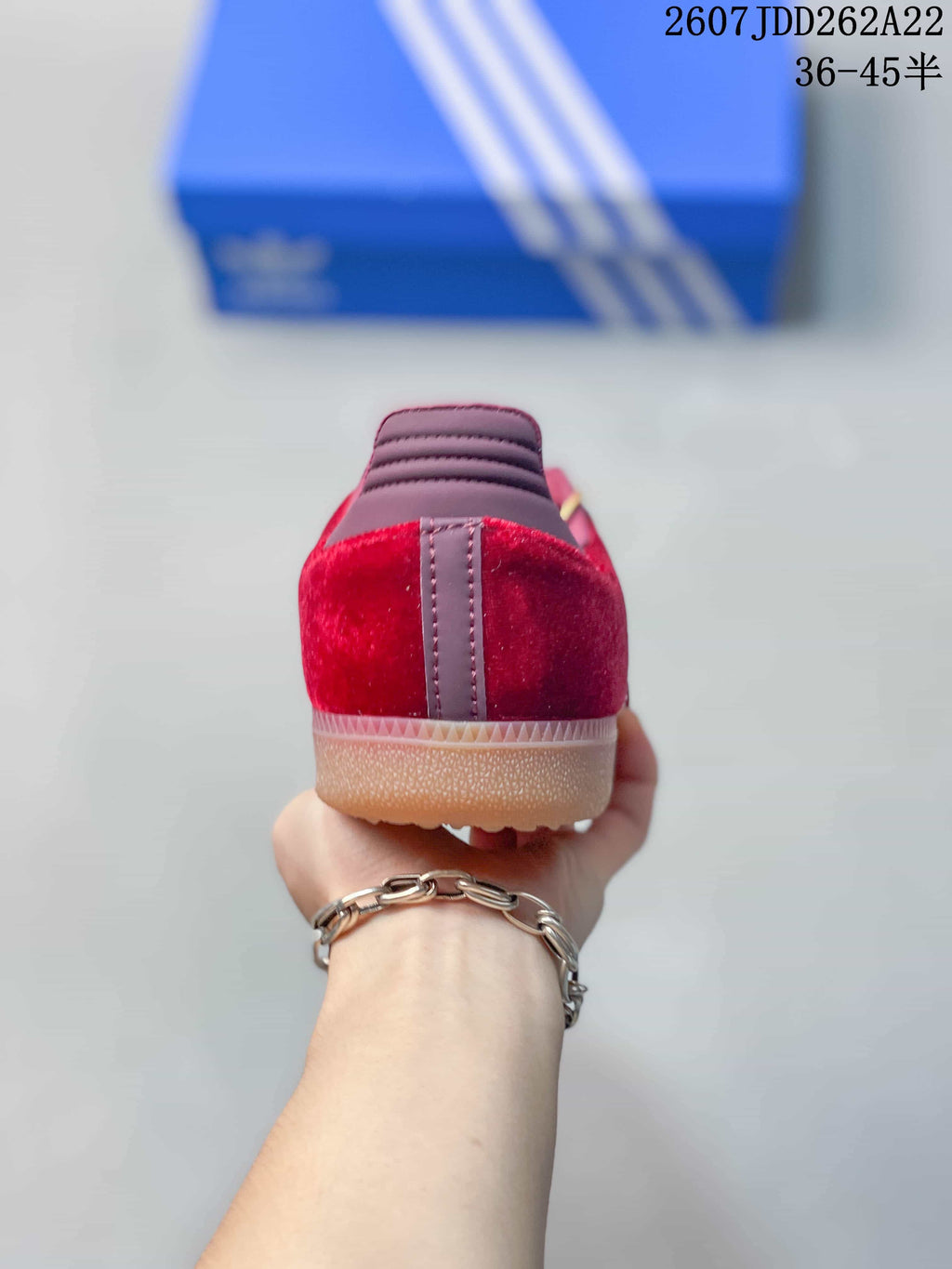 Rear view highlighting the burgundy heel panels, padded collars, and gum outsole.