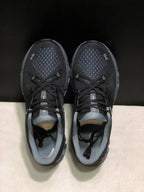 Top view showing the black textured uppers, blue detailing, laces, and gray collars.