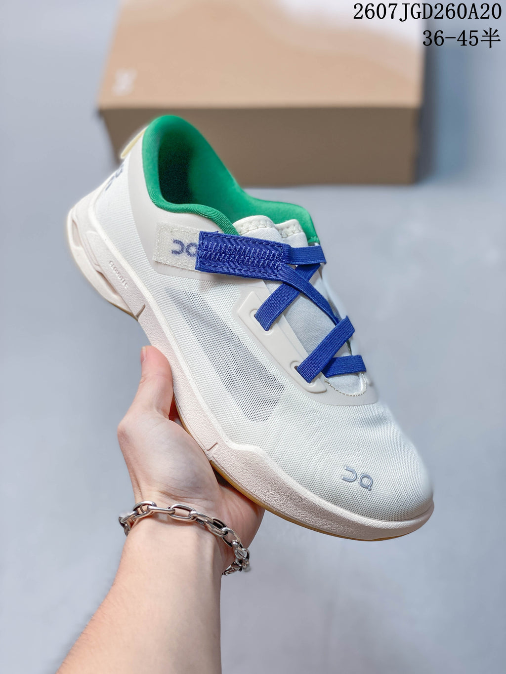 Angled side view of the white On Cloudnova sneaker showing the blue straps, green lining, side panel, and gum-colored outsole.
