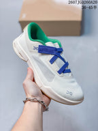 Angled side view of the white On Cloudnova sneaker showing the blue straps, green lining, side panel, and gum-colored outsole.