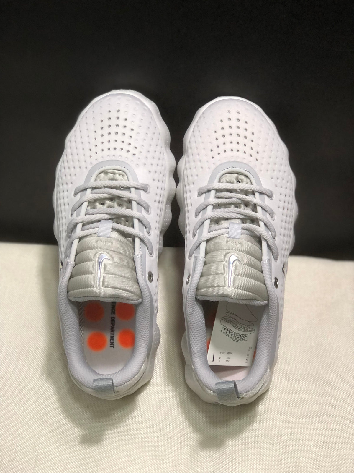 Top view of the pair showing the perforated toe boxes, laces and padded tongues.