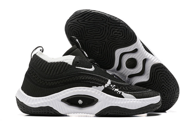 Black and white Nike Anthony Edwards 3 shoes, with outsole view
