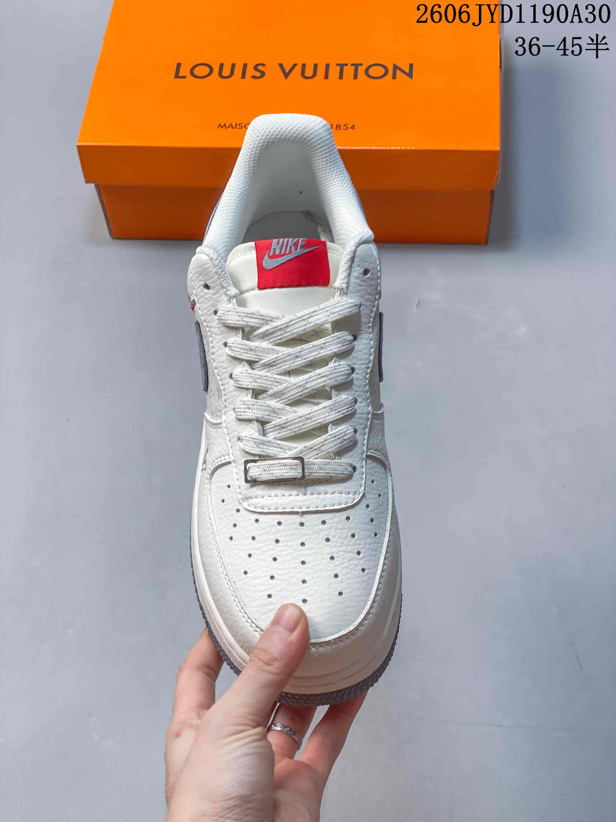 Front view showing the perforated toe, laces, and red tongue label