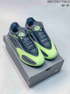 Pair of black and neon green Jordan Triangle basketball shoes displayed on a Jordan-branded box.