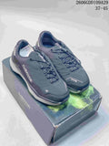Pair of dark gray LOWA low-cut outdoor shoes on a branded box