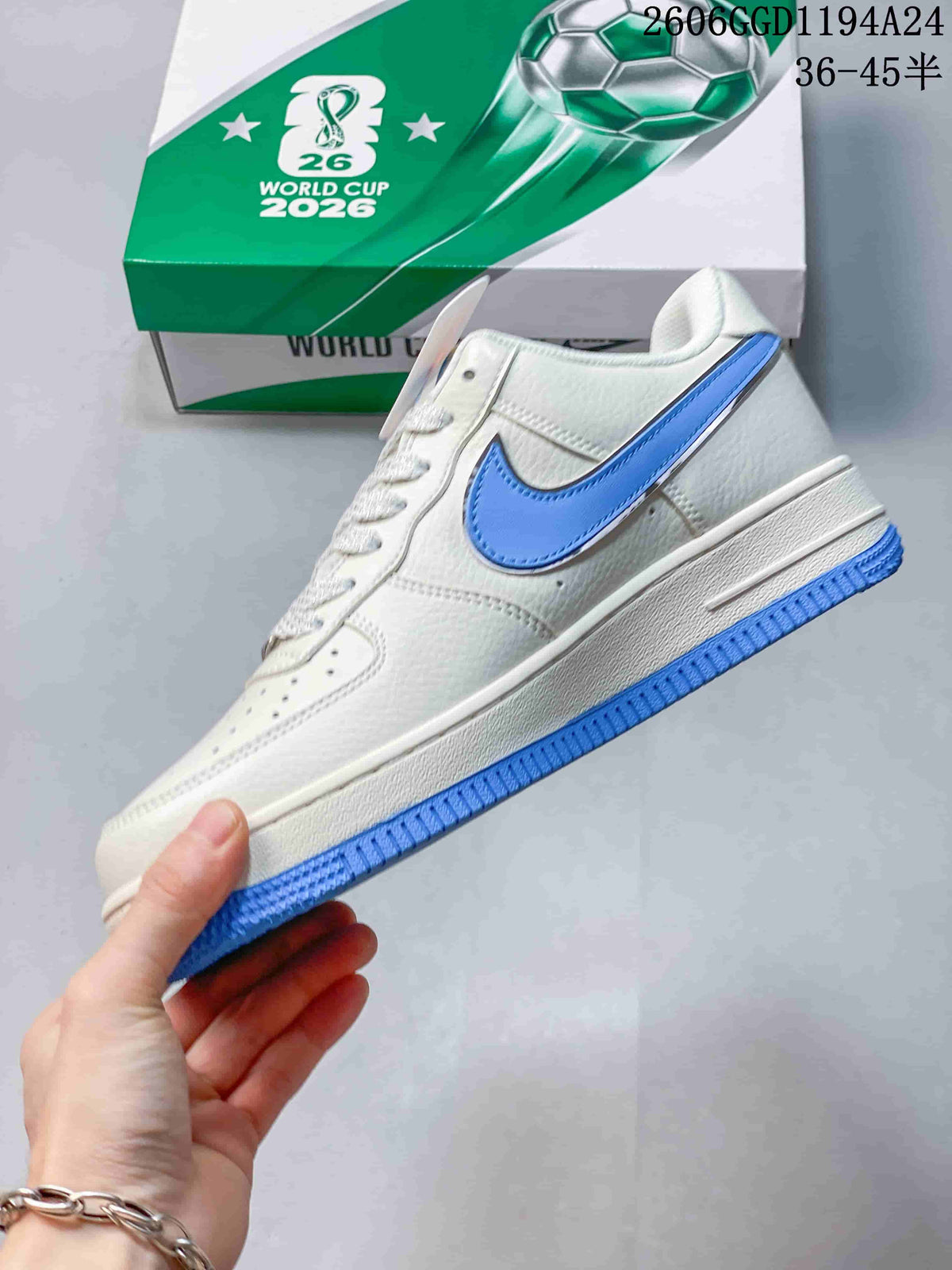 Side view of the white low-top sneaker with blue Swoosh and blue outsole.
