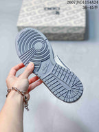 Close-up of the grey rubber outsole showing circular and grid traction sections with Nike branding.