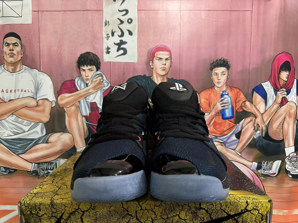 Front view of black Nike basketball sneakers showing padded tongues, laces and translucent toe outsoles.