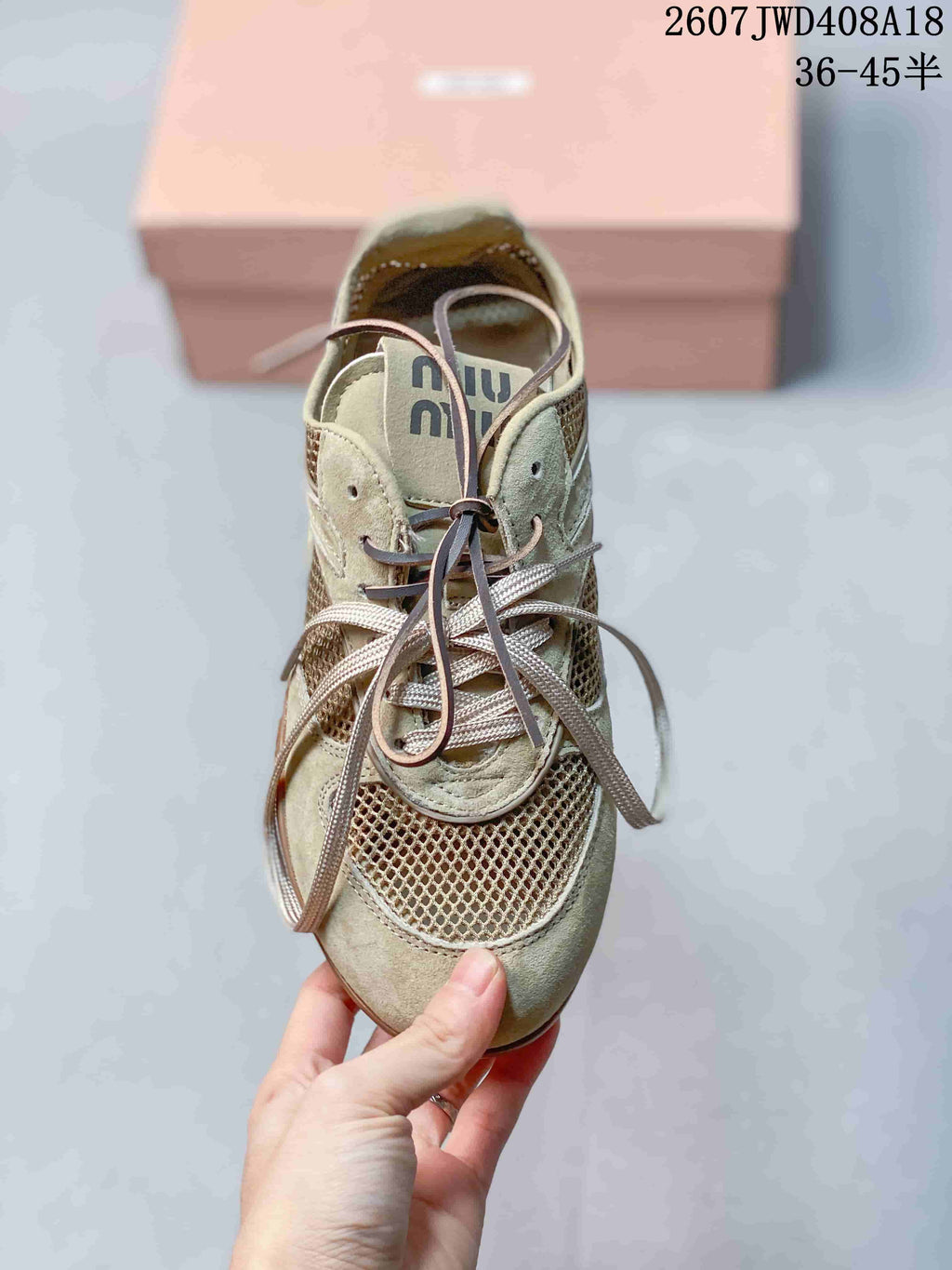Top view showing the rounded toe, mesh vamp, layered tongue, eyelets, and long lace arrangement.