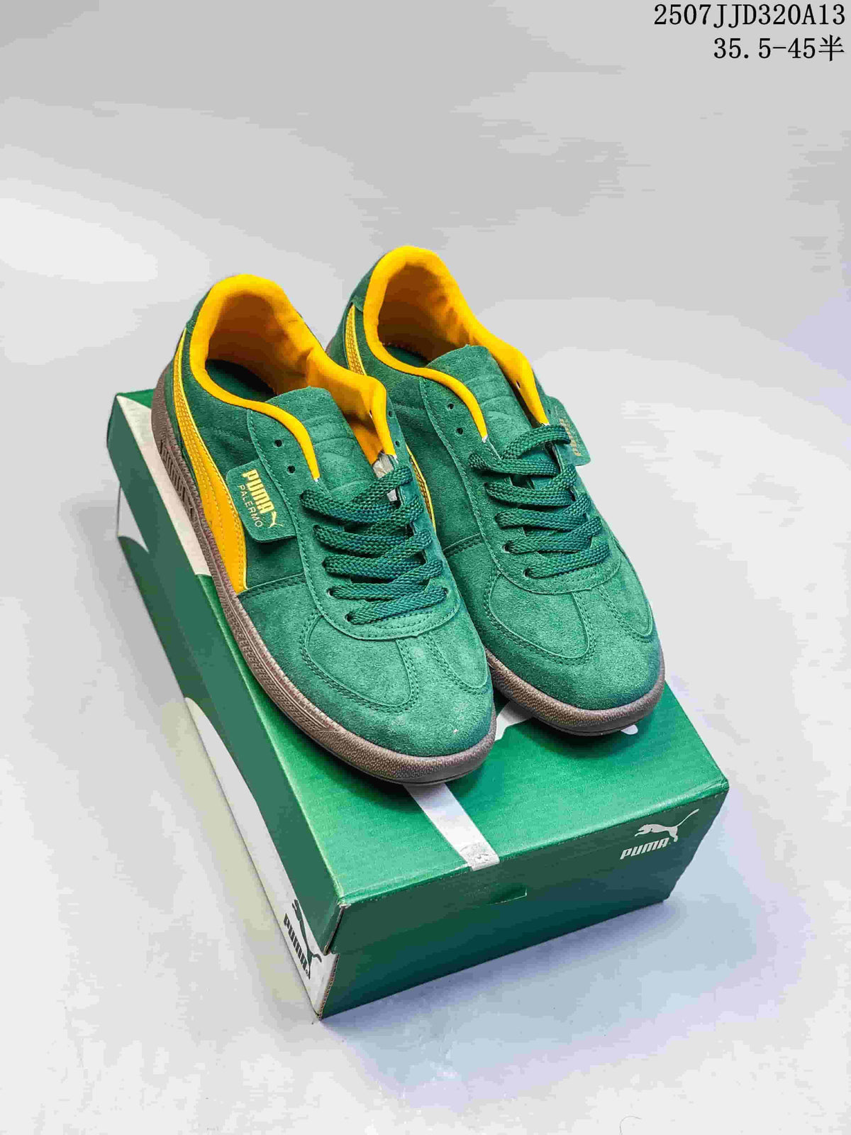 Pair of green and yellow PUMA Palermo sneakers displayed on a PUMA shoebox.