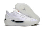 White Jordan sneaker side view beside its patterned outsole.