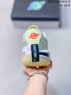 Rear view of the shoe showing the padded heel, “BEYOND” branding, and bright green outsole accents.