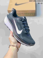 Dark charcoal Nike Zoom Fly 5 sneaker with a white Swoosh and white layered sole.