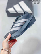 Side profile showing the low-top shape, white stripe detailing, and dark outsole.
