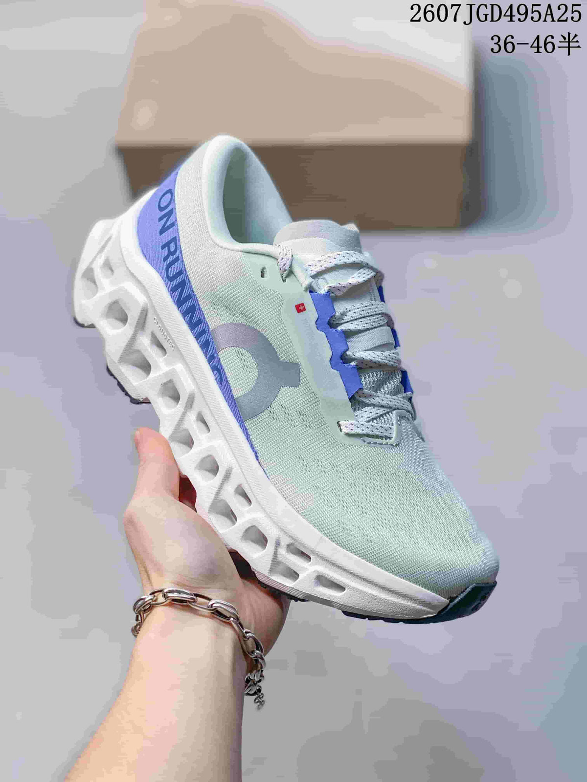 Angled side view showing On branding, blue heel detailing and the sculpted sole