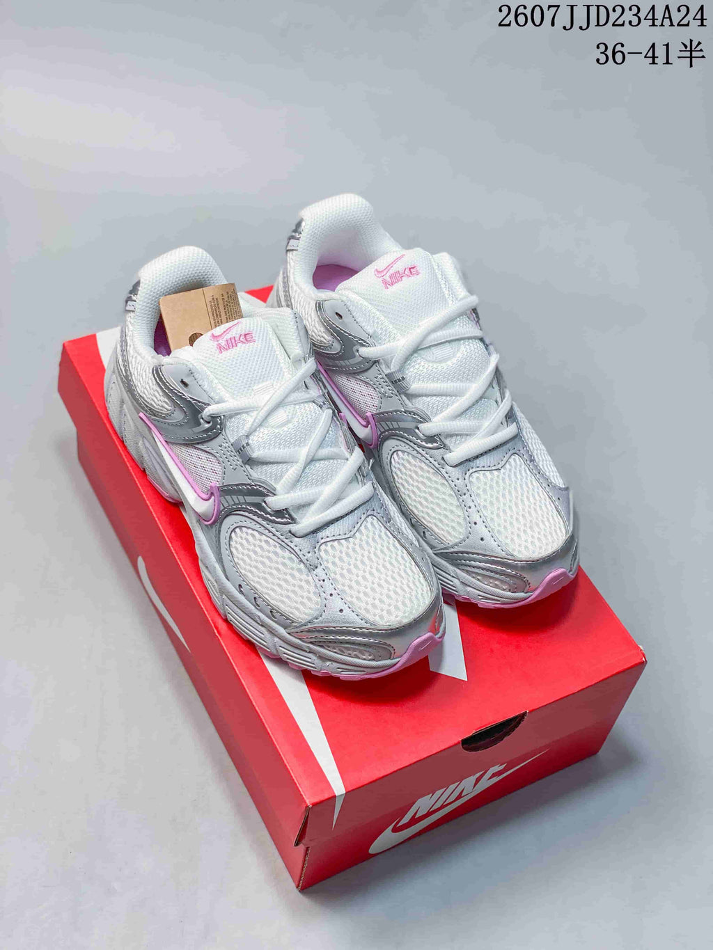 Pair of white, silver, and pink Nike V5 RNR sneakers displayed on a red shoebox; overlay shows style code 2607JJD234A24 and sizes 36–41.5.