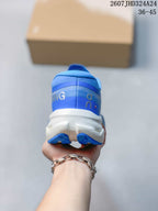 Rear view of the blue running shoe showing the padded heel, layered heel construction, and white midsole; image text shows style code 2607JHD324A24 and size range 36–45.