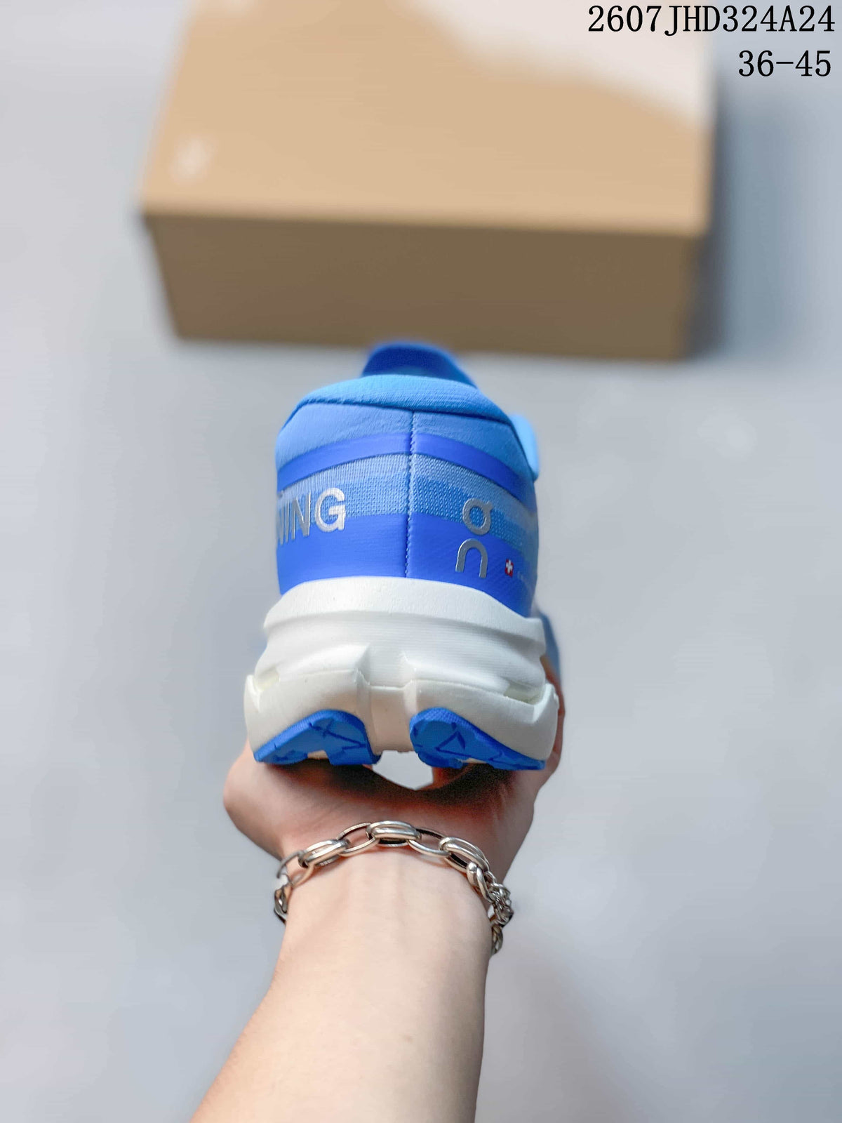 Rear view of the blue running shoe showing the padded heel, layered heel construction, and white midsole; image text shows style code 2607JHD324A24 and size range 36–45.