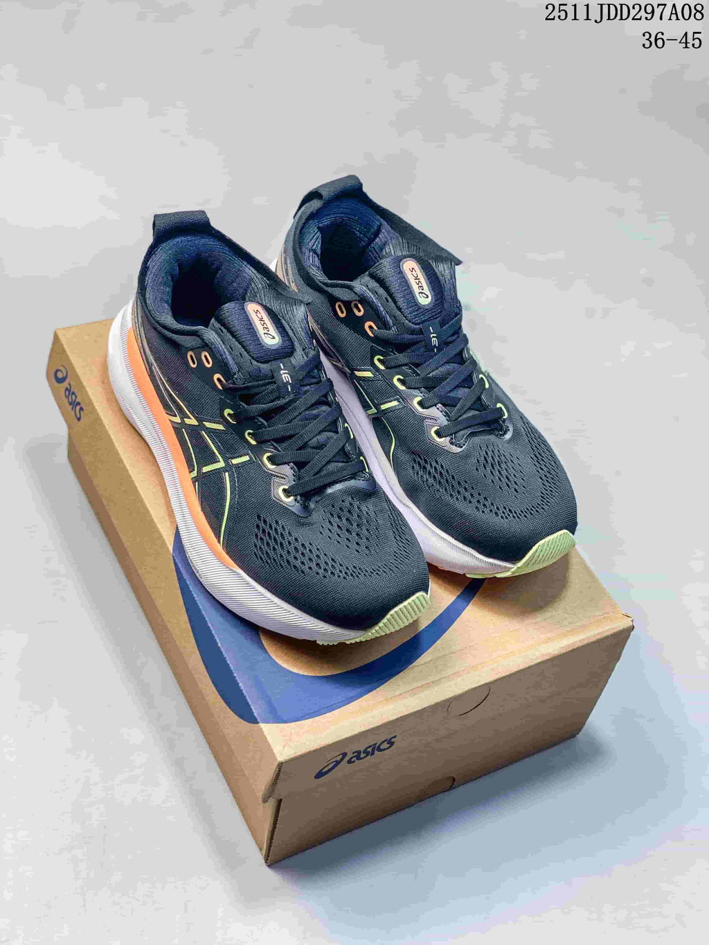 Pair of black ASICS running shoes with green and orange accents on an ASICS shoe box; image text shows style code 2511JDD297A08 and size range 36–45.