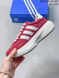 Red Adidas Adizero SL 72 Pro sneaker with white stripes and thick white sole, shown in profile beside a blue shoe box.