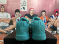 Rear view of lake-blue Nike Kobe basketball shoes showing heel detailing.