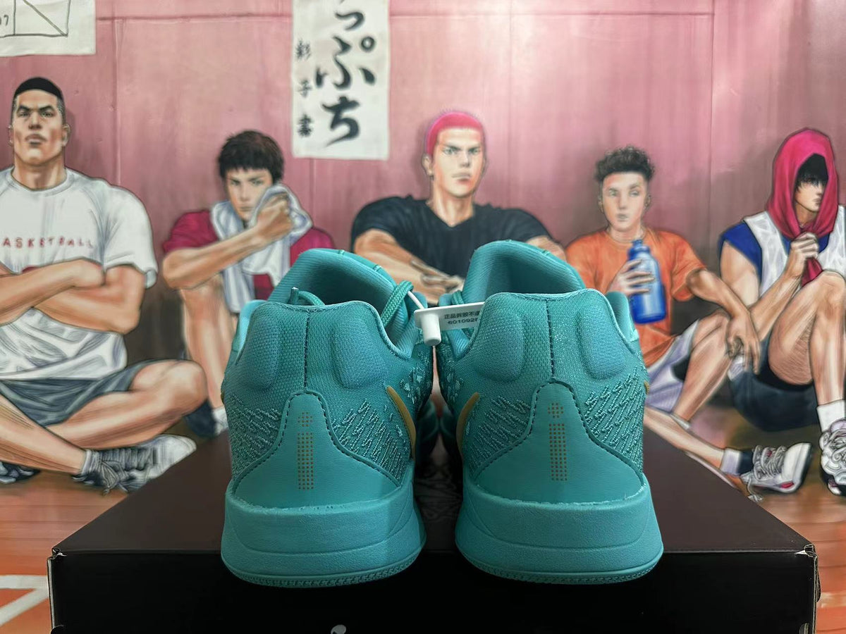 Rear view of lake-blue Nike Kobe basketball shoes showing heel detailing.